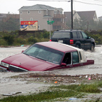 Car awash in flood waters