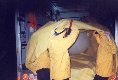 Inflating latex balloon inside a 'balloon truck'
