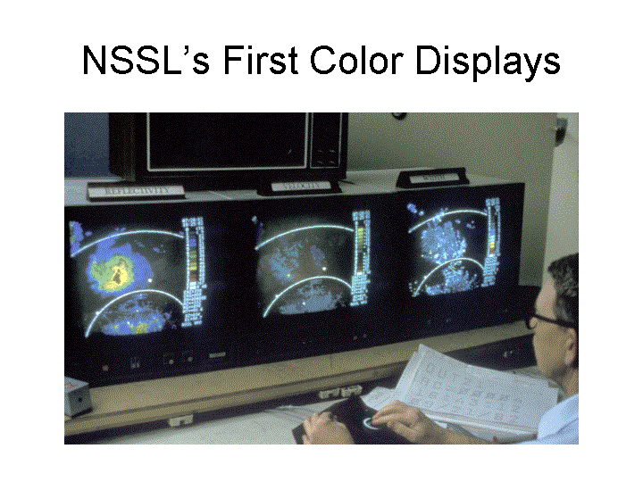 Radar technician Chuck Clark studies the three Doppler color displays of reflectivity, velocity and spectrum width