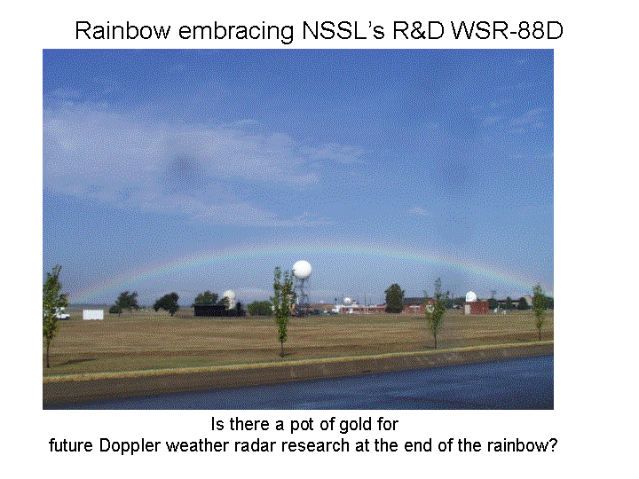 The image shows a rainbow spanning NSSL and all its radar facilities