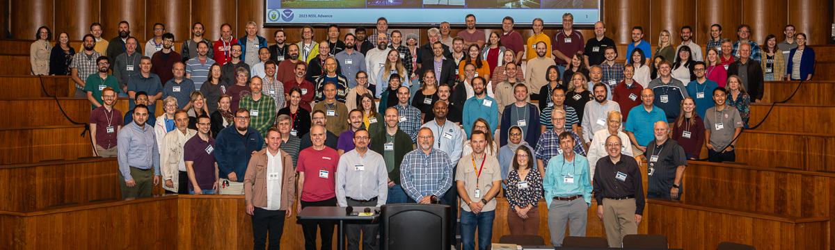 NSSL staff in a wood-paneled room