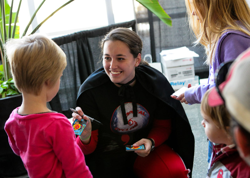 Cyclone Girl autographs a card