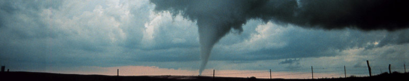 tornado in a rural area at sunset