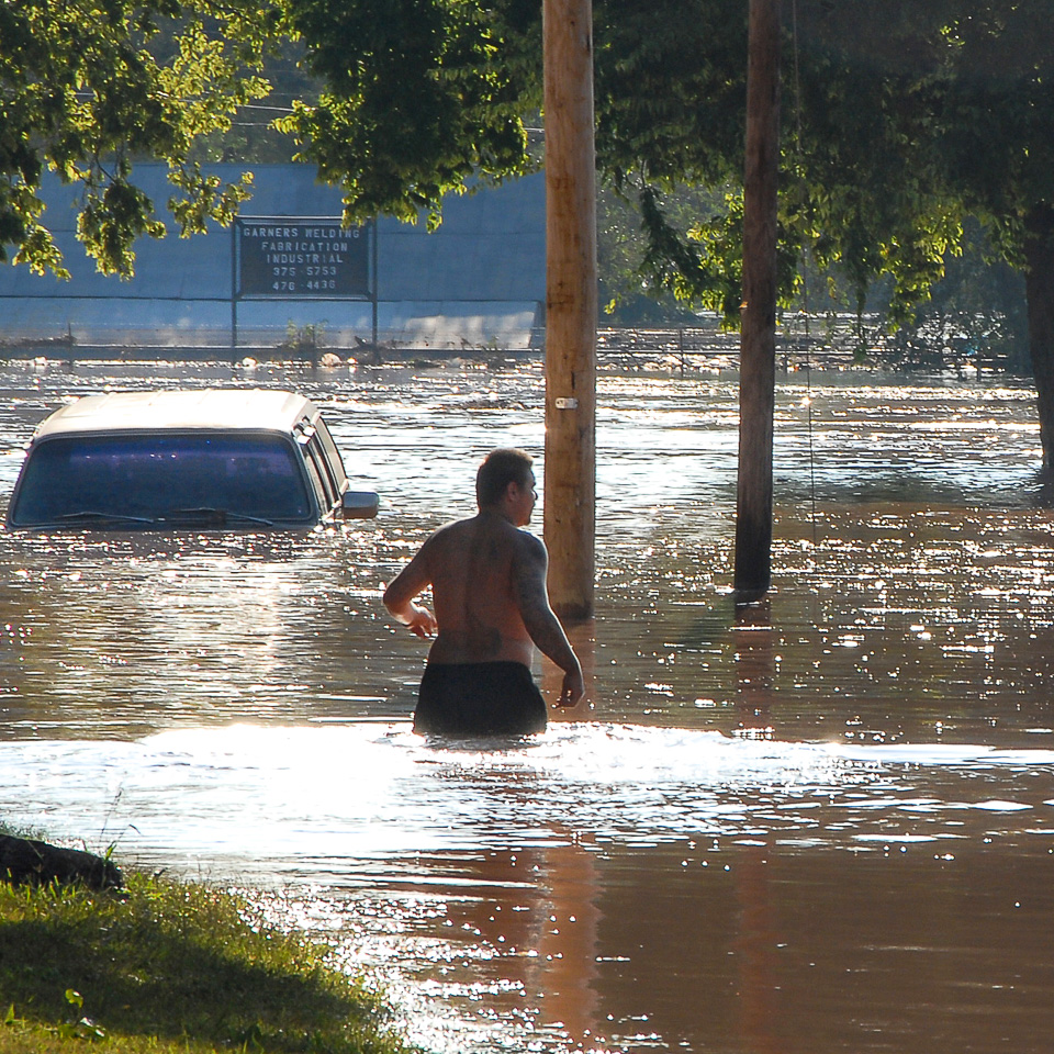 man wading in waist deep water