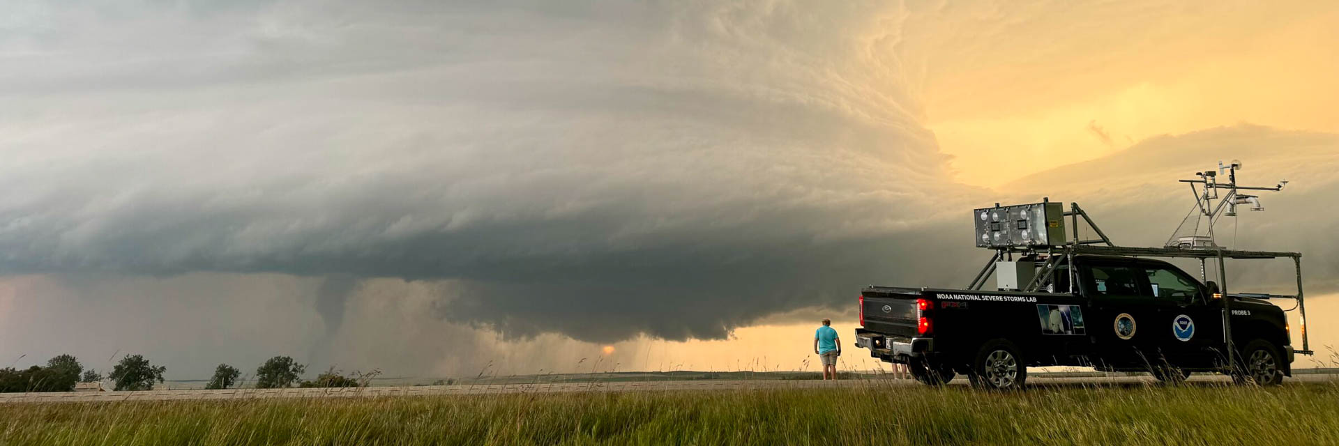 Truck with instruments mounted to the roof, in front of a tornado