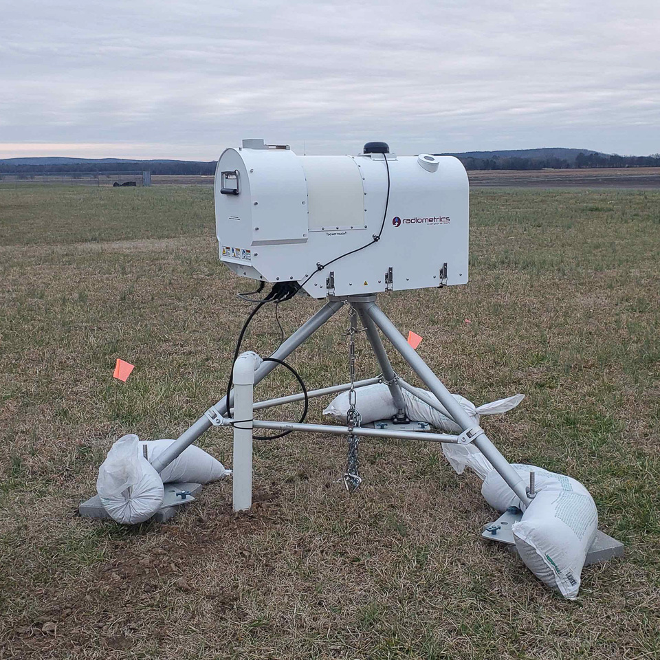 instrumentation on tripod in a pasture