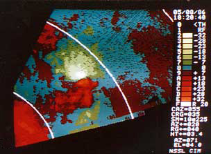 A PPI display of Doppler velocities from converging flow a few hundred meters AGL in the Edmond, Okla., tornadic storm of 8 May 1986, but from an almost purely rotating flow at 2.3 km AGL in the Edmond storm's cyclone.